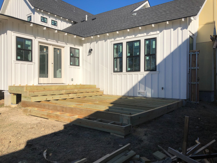 New asphalt shingle roof installation on a two-story home