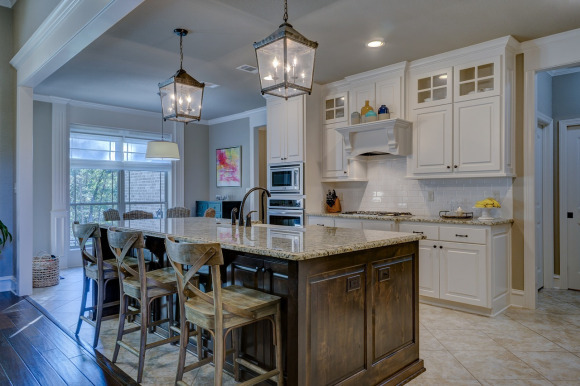 Custom kitchen remodel with shaker cabinets, quartz counters, and tile backsplash